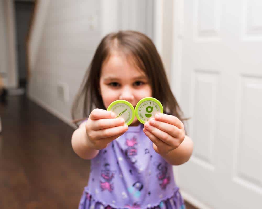 Aren holding two goodtimer tokens