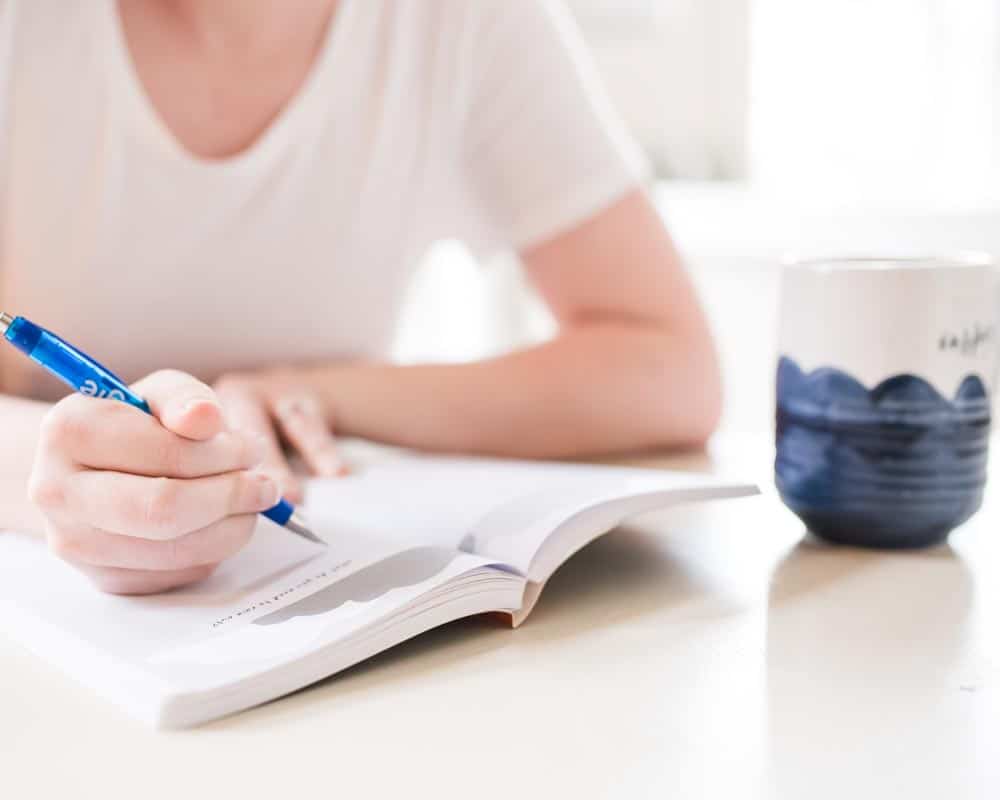 hand writing in journal for teens